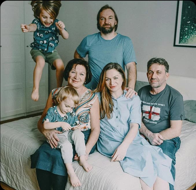 Family gathered on bed